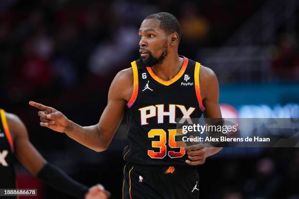 Kevin Durant of the Phoenix Suns reacts after sinking a three point shot in the third quarter of the game against the Houston Rockets at Toyota...