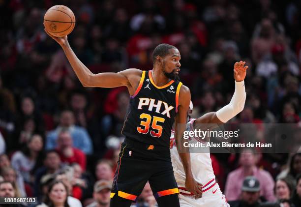 Kevin Durant of the Phoenix Suns holds the ball during the second half of the game against the Houston Rockets at Toyota Center on December 27, 2023...