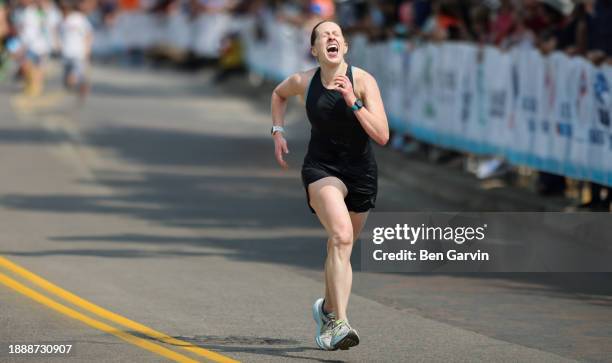 powerful marathon finish line celebration moment - exhausted at finish line stock pictures, royalty-free photos & images