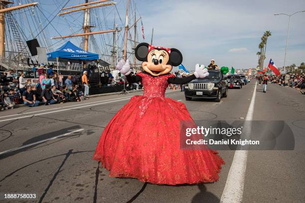 Minnie Mouse cosplayer marches during the Port of San Diego Holiday Bowl Parade on December 27, 2023 in San Diego, California.