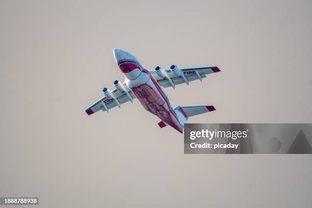 fire fighting air planes in flight - kelowna stock pictures, royalty-free photos & images