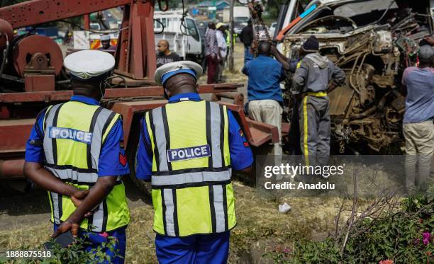 Police officers inspect incident site after a truck and two cars crashed on the Nakuru-Eldoret highway causing at least 8 casualties in Nakuru city...
