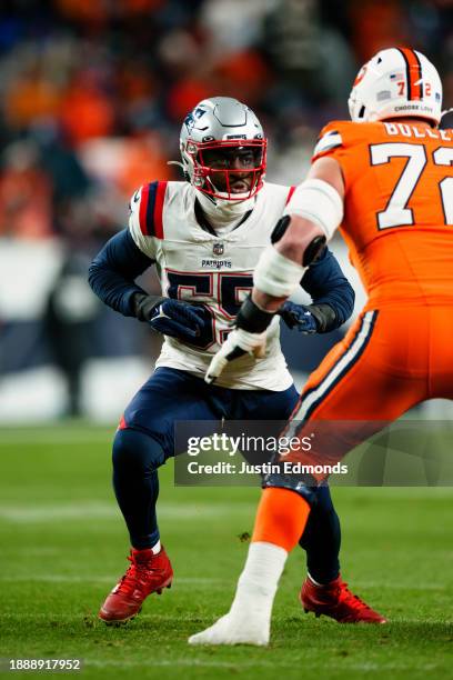 Linebacker Josh Uche of the New England Patriots rushes against offensive tackle Garett Bolles of the Denver Broncos at Empower Field at Mile High on...