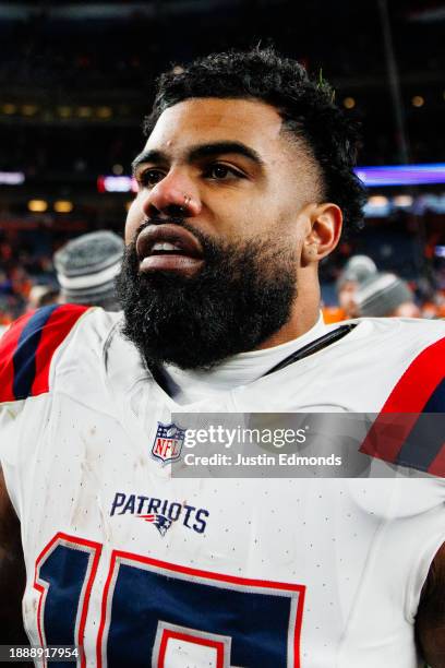 Running back Ezekiel Elliott of the New England Patriots walks on the field after the 26-23 win against the Denver Broncos at Empower Field at Mile...