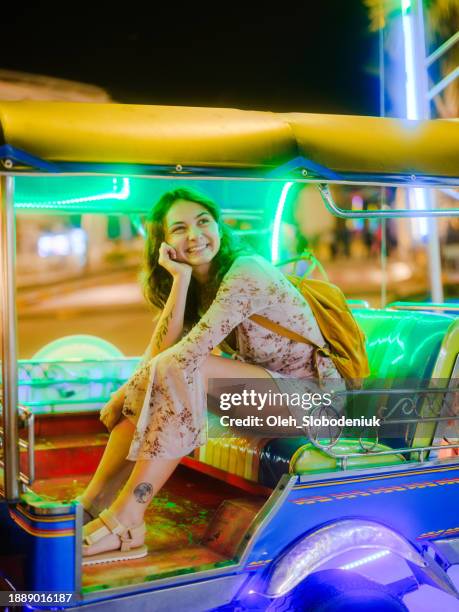 woman  in  tuk-tuk in bangkok at night - break stock pictures, royalty-free photos & images