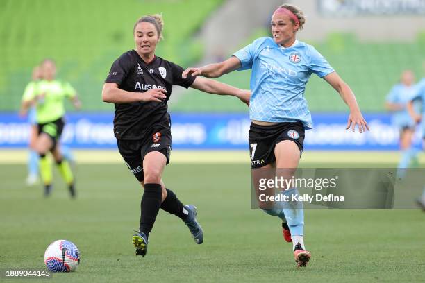 Hannah Wilkinson of Melbourne City competes for the ball against Jenna McCormick of the Roar during the A-League Women round 10 match between...