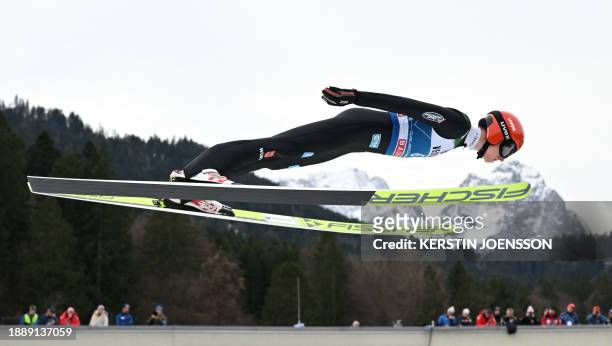 Germany's Karl Geiger soars through the air during a training jump for the second stage of the Four-Hills tournament that is part of the FIS Ski...