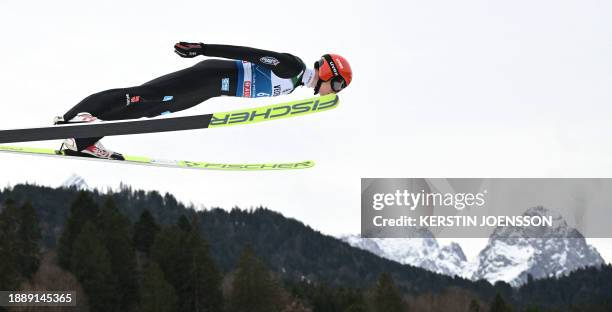 Germany's Karl Geiger soars through the air during a training jump for the second stage of the Four-Hills tournament that is part of the FIS Ski...