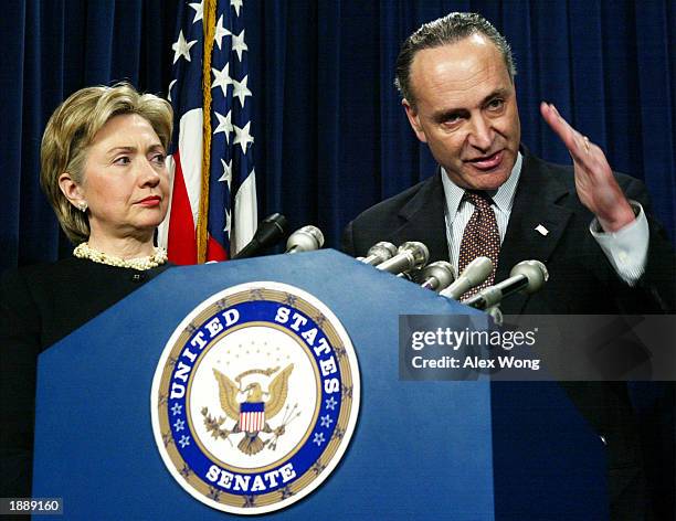 Senator Chuck Schumer speaks as Senator Hillary Rodham Clinton looks on during a news conference to unveil a package of homeland security amendments...