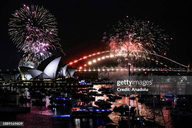 View of the Sydney New Year's Eve Firework show displayed three hours before midnight every year around Sydney Harbour Bridge in Sydney, Australia on...