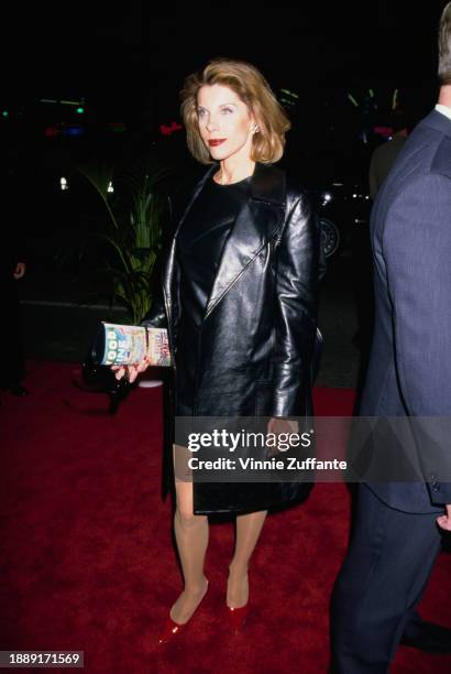 American actress and singer Christine Baranski, wearing a black dress beneath a black three-quarter length leather coat, attends the Hollywood...