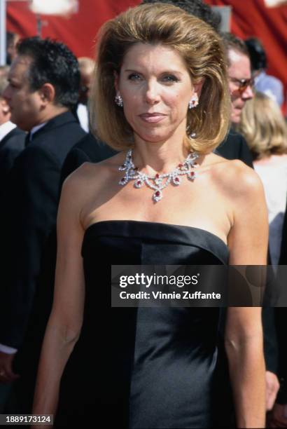 American actress and singer Christine Baranski, wearing a black off-shoulder evening gown, attends the 50th Annual Primetime Emmy Awards, held at the...