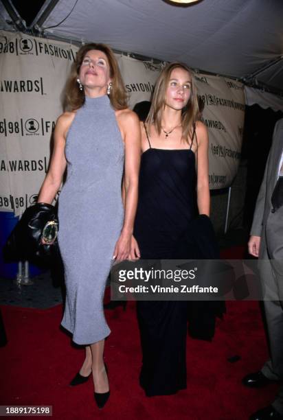 American actress and singer Christine Baranski, wearing a grey high-neck dress, and her daughter, Isabel Cowles, who wears a black dress with...