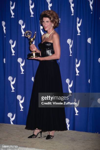 American actress and singer Christine Baranski, wearing a black off-shoulder evening gown, in the press room of the 47th Primetime Emmy Awards, held...