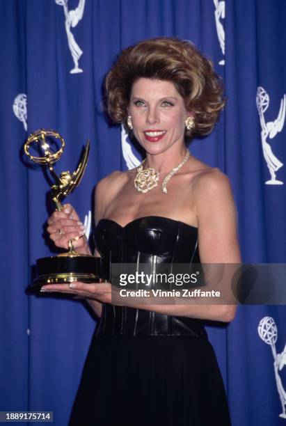 American actress and singer Christine Baranski, wearing a black off-shoulder evening gown, in the press room of the 47th Primetime Emmy Awards, held...