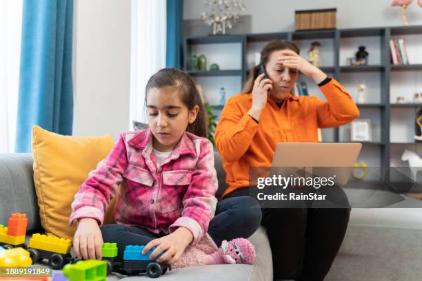 worried woman looking at smartphone has money stolen from card - juvenile crime stock pictures, royalty-free photos & images