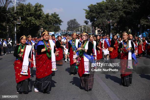 Members of the Nepalese Gurung community are dancing to the tune of a traditional instrument during the celebration of Tamu Lhosar in Kathmandu,...