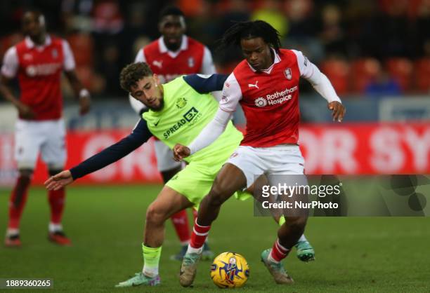 Adil Aouchiche of Sunderland is fouling Dexter Lembikisa from Rotherham United during the Sky Bet Championship match between Rotherham United and...