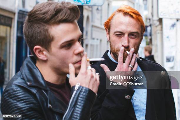 enjoying a smoke in the company of a friend - a j price stock pictures, royalty-free photos & images