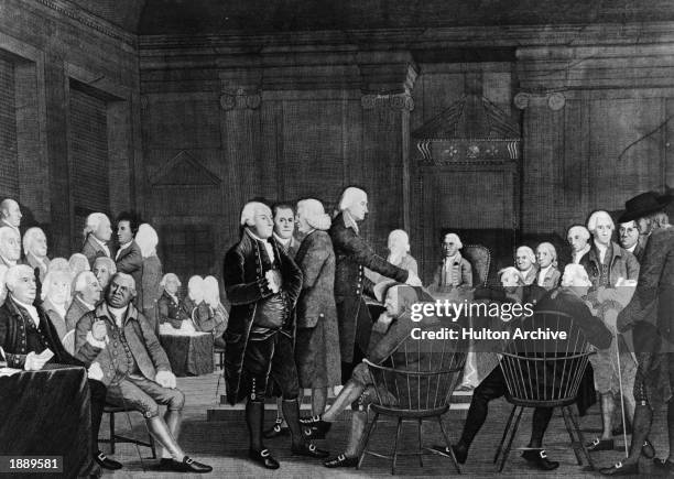 Members of the Second Continental Congress prepare documentation for the Declaration of Independence in the Assembly Room of the Pennsylvania State...