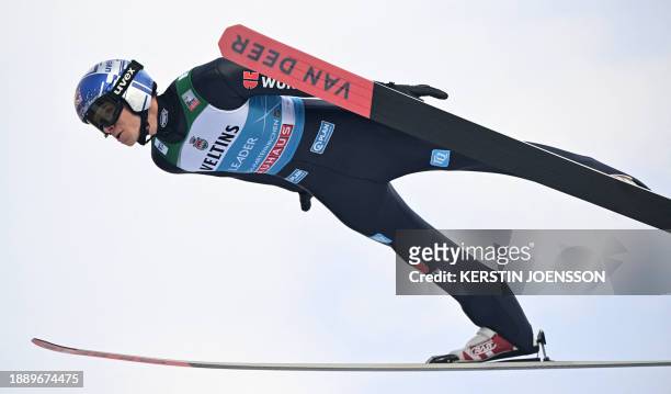 Germany's Andreas Wellinger soars through the air during the qualification for the second stage of the Four-Hills tournament that is part of the FIS...
