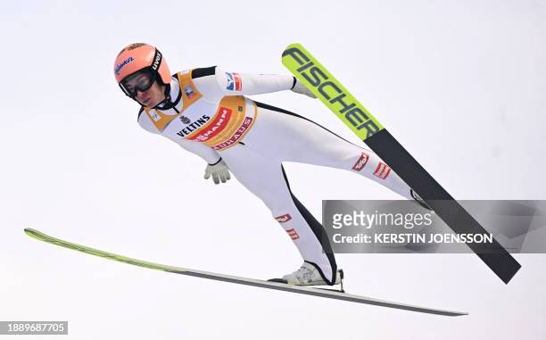 Austria's Stefan Kraft soars through the air during the qualification for the second stage of the Four-Hills tournament that is part of the FIS Ski...