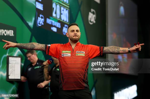 Joe Cullen of England celebrates winning his round three match against Ryan Searle of England on day 11 of the 2023/24 Paddy Power World Darts...