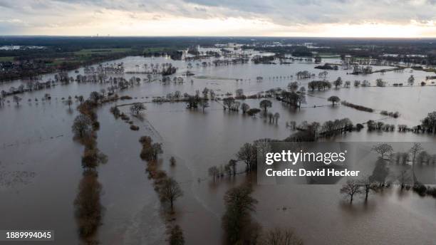 In this aerial view the landscape is flooded by the river Ems on December 31, 2023 in Meppen, Germany. Authorities and emergency crews have been...