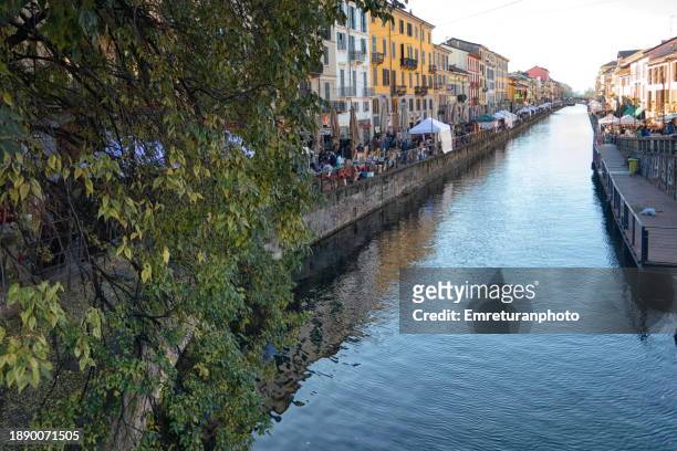 high angle view of canal at navigli on a sunny day in autumn. - milano navigli stock-fotos und bilder