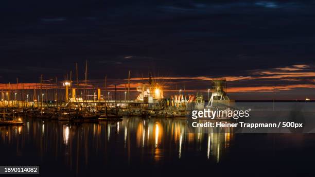 view of illuminated harbor at night,cuxhaven,niedersachsen,germany - cuxhaven stock-fotos und bilder