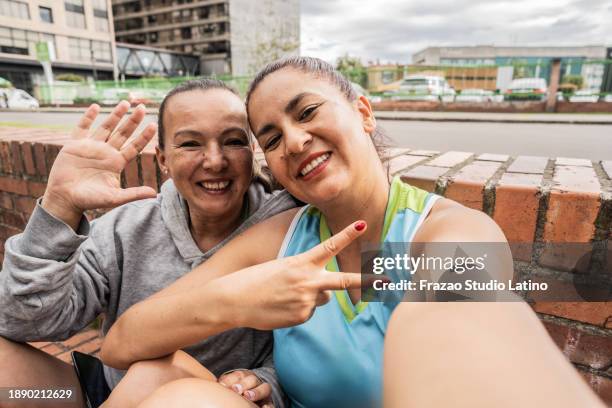 friends taking a selfie outdoors - camera point of view - amateur photo stock pictures, royalty-free photos & images