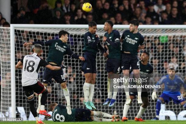 Fulham's Brazilian midfielder Andreas Pereira takes a freekick during the English Premier League football match between Fulham and Arsenal at Craven...
