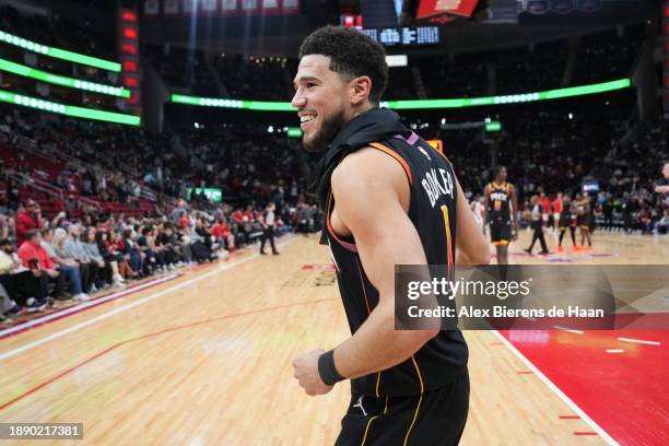 Devin Booker of the Phoenix Suns reacts after the end of the game against the Houston Rockets at Toyota Center on December 27, 2023 in Houston,...