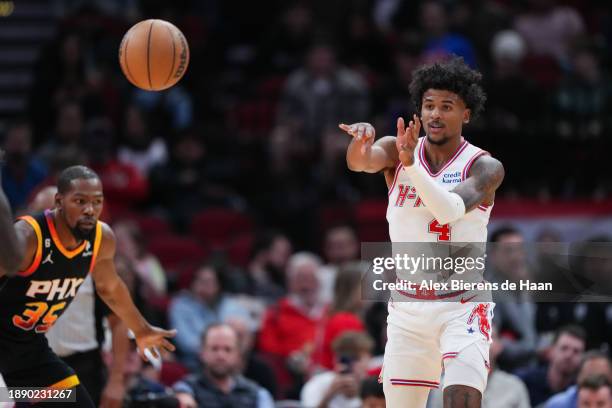 Jalen Green of the Houston Rockets passes the ball during the first half of the game against the Phoenix Suns at Toyota Center on December 27, 2023...