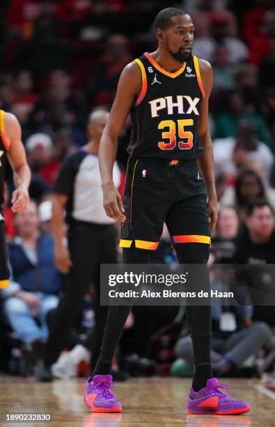 Kevin Durant of the Phoenix Suns looks on during the first half of the game against the Houston Rockets at Toyota Center on December 27, 2023 in...