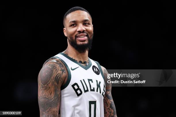 Damian Lillard of the Milwaukee Bucks looks on during the fourth quarter of the game against the Brooklyn Nets at Barclays Center on December 27,...