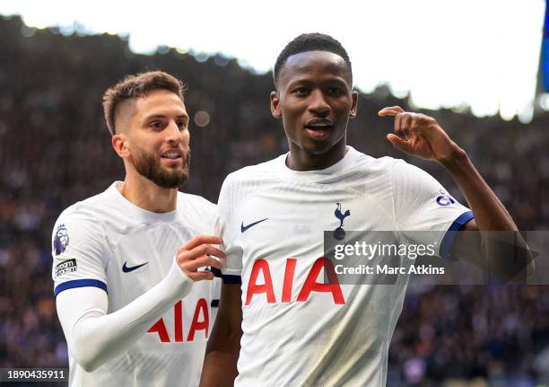 Pape Matar Sarr of Tottenham Hotspur celebrates scoring the opening goal with Rodrigo Bentancur during the Premier League match between Tottenham...