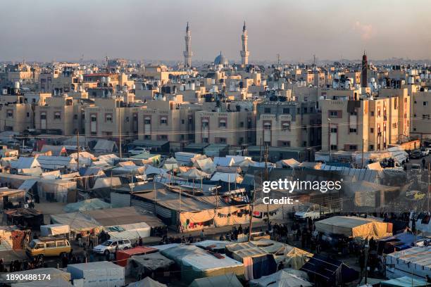 The Taiba mosque is pictured in the background near the tent camps of displaced Palestinians in Rafah in the southern Gaza Strip close to the border...