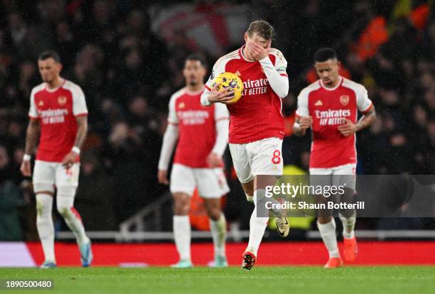 Martin Odegaard of Arsenal reacts after Konstantinos Mavropanos of West Ham United scores their team's second goal during the Premier League match...