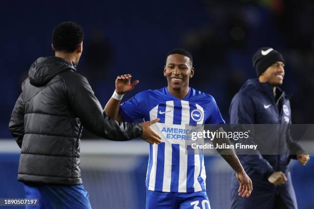 Pervis Estupinan of Brighton & Hove Albion celebrates after defeating Tottenham Hotspur during the Premier League match between Brighton & Hove...