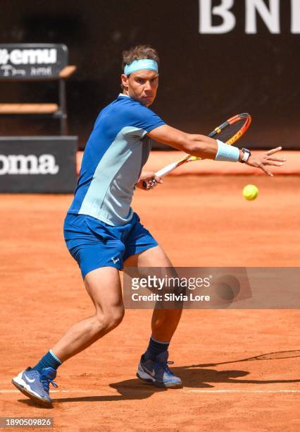 Rafael Nadal of Spain plays a forehand to John Isner of USA in their 2nd Round Singles match on day three of the Internazionali BNL D'Italia at Foro...
