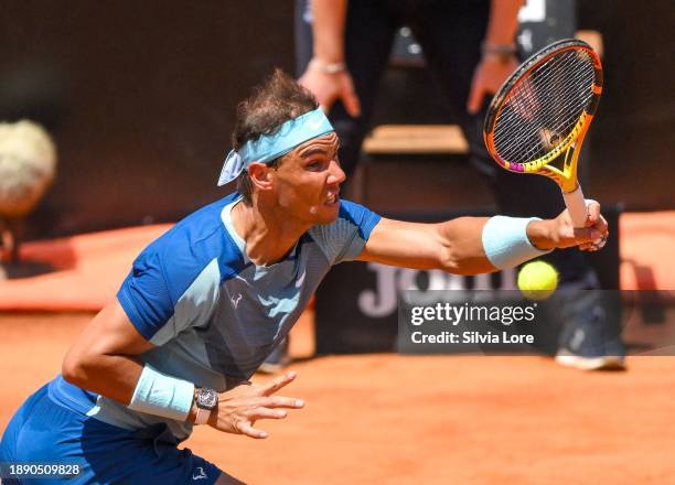 Rafael Nadal of Spain plays a forehand to John Isner of USA in their 2nd Round Singles match on day three of the Internazionali BNL D'Italia at Foro...