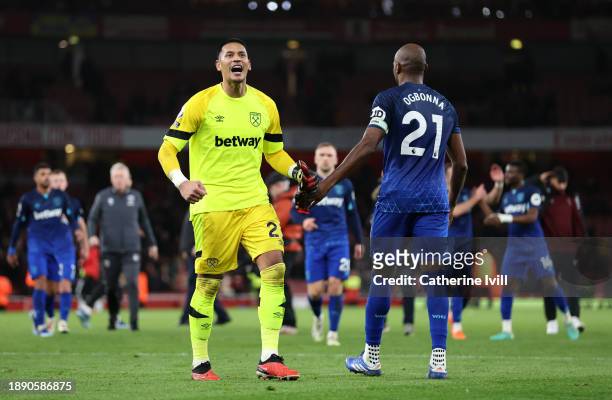 Alphonse Areola of West Ham United celebrates with teammates in front of fans of West Ham United after defeating Arsenal during the Premier League...