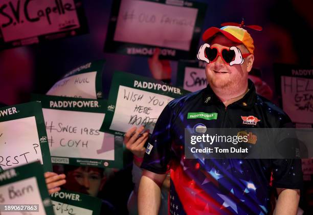 Ricky Evans of England smiles during his round three match against Daryl Gurney of Ireland on day 11 of the 2023/24 Paddy Power World Darts...