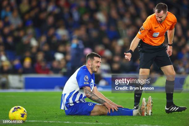 Referee Jarred Gillett signals to Lewis Dunk of Brighton & Hove Albion during the Premier League match between Brighton & Hove Albion and Tottenham...