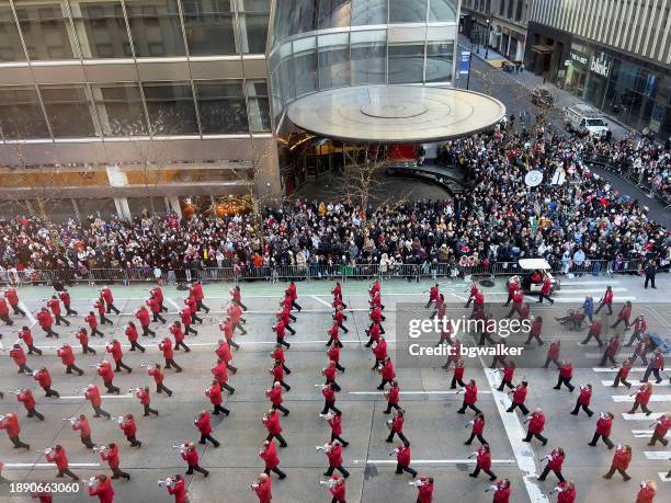 marching band in thanksgiving parade - parade crowd stock pictures, royalty-free photos & images