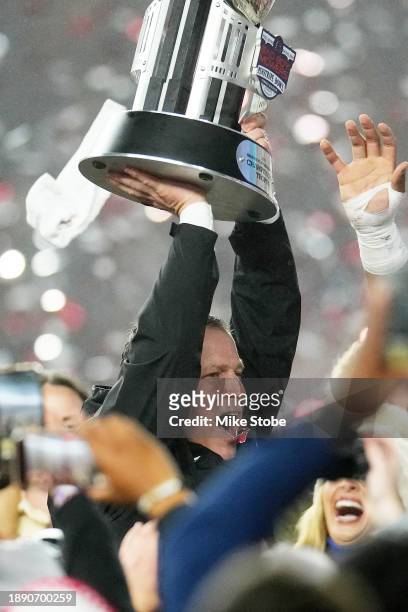 Head coach Greg Schiano of the Rutgers Scarlet Knights celebrate after defeating the Miami Hurricanes 31-24 to win the Bad Boy Mowers Pinstripe Bowl...