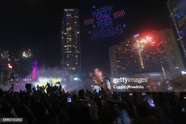 Thousands of people gather at Bundaran Hotel during Car Free Night to celebrate New Year's Eve in Jakarta, Indonesia on January 01, 2024.