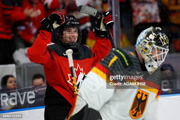 Canada's forward Macklin Celebrini celebrates scoring the 5-3 goal during the Group A ice hockey match between Canada and Germany of the IIHF World...