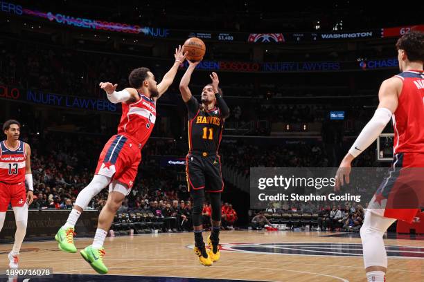 Trae Young of the Atlanta Hawks shoots the ball during the game against the Washington Wizards on December 31, 2023 at Capital One Arena in...